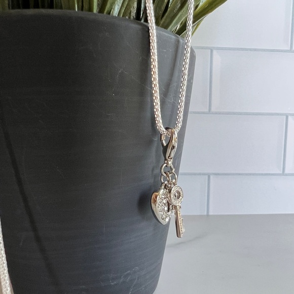 3/$25 Guess Modern Silver & Crystal Detailed Key and Lock 32” Adj Necklace - Picture 2 of 6